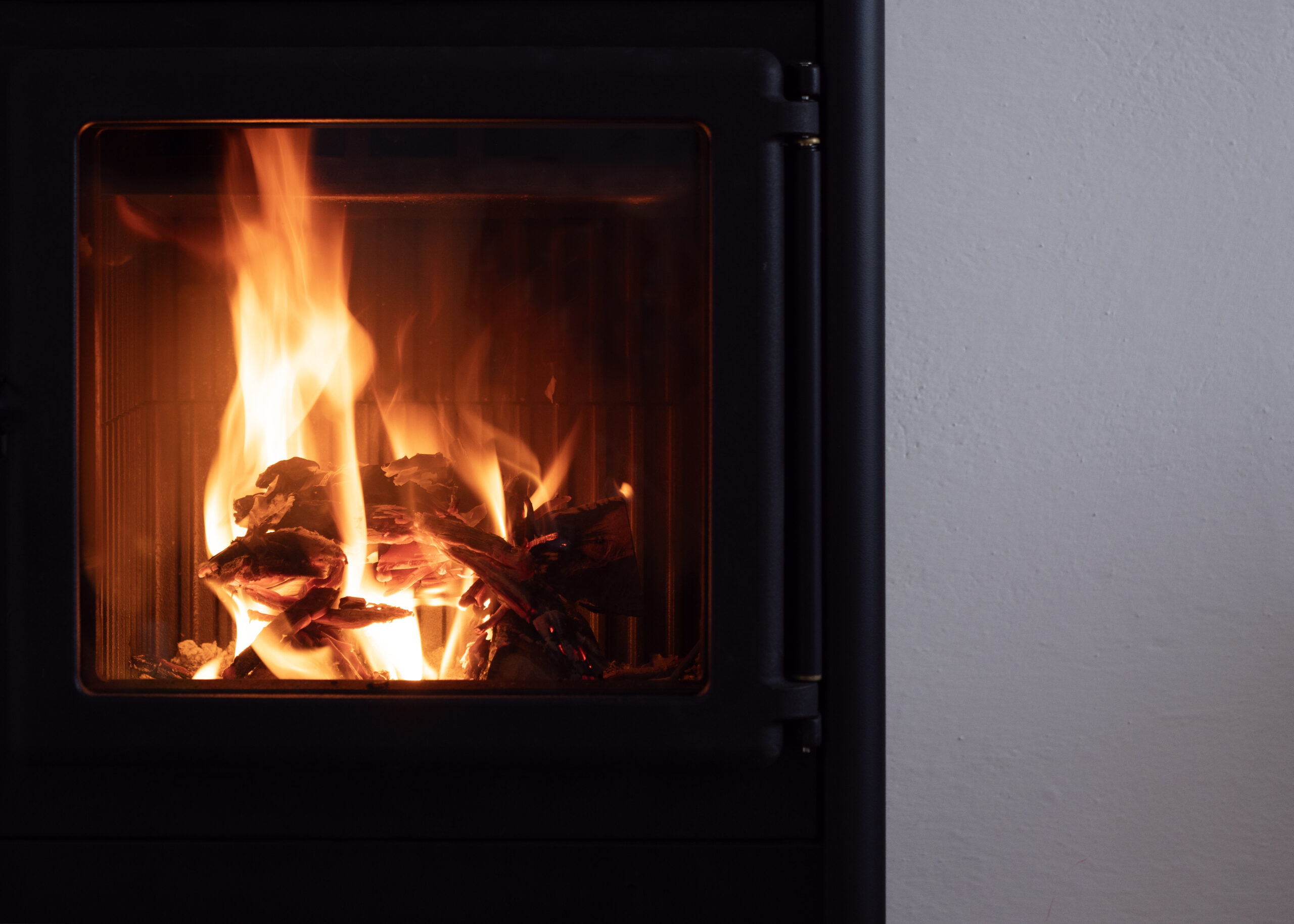 modern wood stove home heating with fire